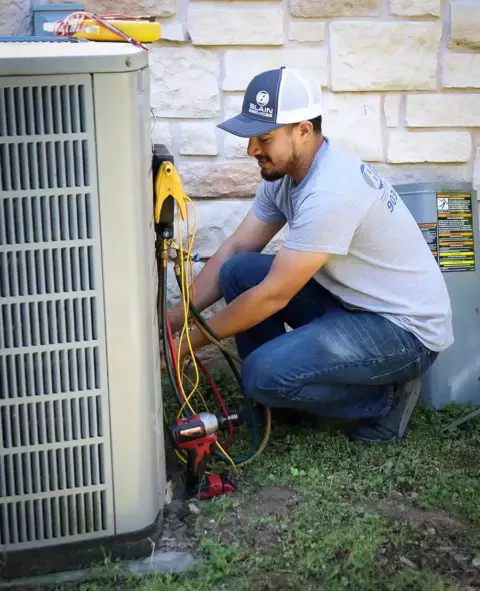 Blain Services Technician Working On AC repair of air conditioning Unit